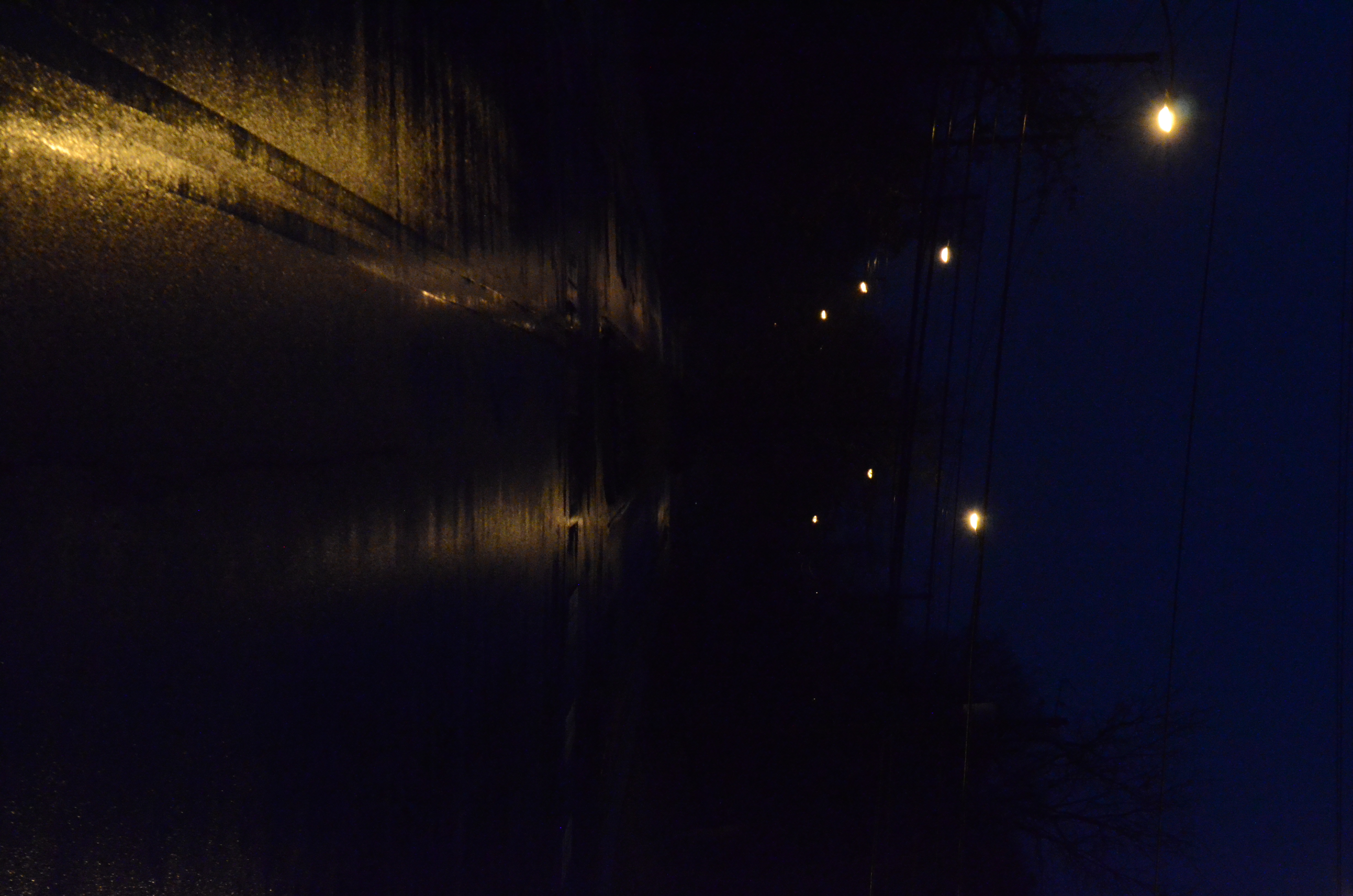 A picure of a road at night wich is very underexposed